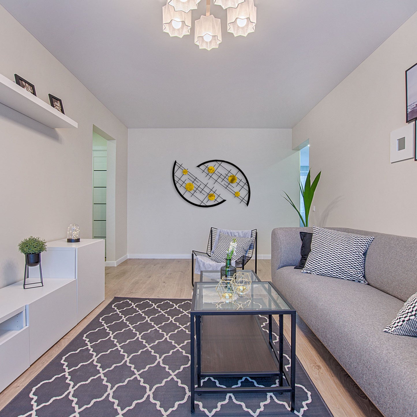 yellow and black look great together, especially for iowa hawkeyes fans who would love the modern design of these interchangeable arcs with yellow circles against a black grid in this modern living space